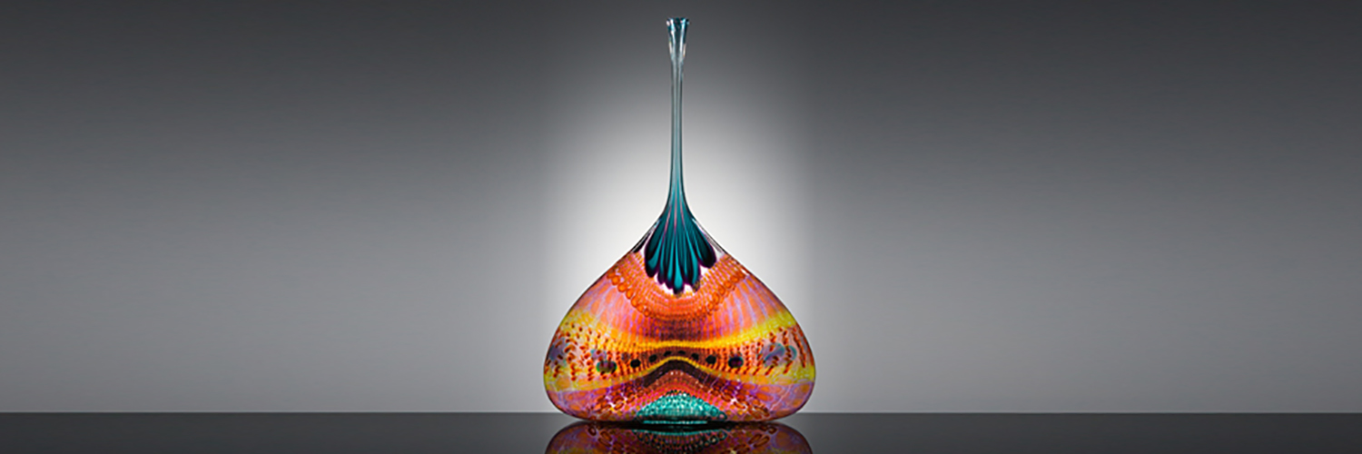 A bulbous glass sculpture with vibrant colors and a long slender kneck.